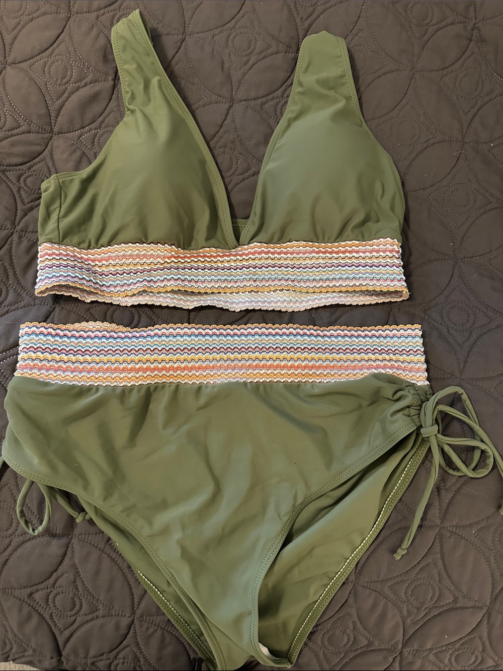 One olive green and one light blue bathingsuit.